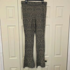 Free People Floral stretch flare shimmer pants.
